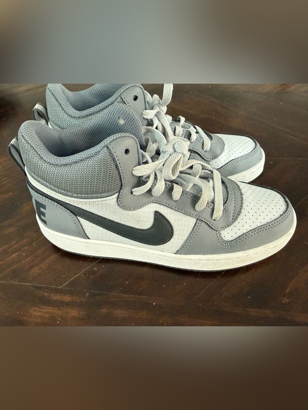 Nike Men’s Gray and White Mid-Top Sneakers with Black Swoosh